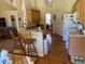 Kitchen view showcasing a breakfast bar, ample cabinets, and hardwood floors at 5298 Autumn Run Dr, Powder Springs, GA 30127