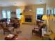 Inviting living room with stone fireplace, large windows, and a comfortable seating area at 5298 Autumn Run Dr, Powder Springs, GA 30127