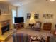 Charming living room with stone fireplace, perfect for relaxation and entertaining at 5298 Autumn Run Dr, Powder Springs, GA 30127