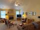 Bright living room with fireplace, large windows, and comfortable seating arrangement at 5298 Autumn Run Dr, Powder Springs, GA 30127