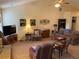 Cozy living room featuring a fireplace, TV, and plush seating area at 5298 Autumn Run Dr, Powder Springs, GA 30127