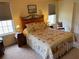 Comfortable bedroom with two windows, neutral tones, and a patterned bedspread at 5298 Autumn Run Dr, Powder Springs, GA 30127
