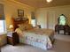 Serene main bedroom with soft lighting, a decorative bed frame, and a vanity area for added convenience at 5298 Autumn Run Dr, Powder Springs, GA 30127