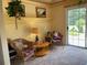 Bright sitting area with direct access to the back yard and lots of natural light at 5298 Autumn Run Dr, Powder Springs, GA 30127
