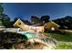 Beautiful backyard with pool, patio, landscaping, and seating area at 5335 Bannergate Dr, Johns Creek, GA 30022