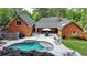 Aerial view of a backyard featuring a pool, patio, lounge chairs, and lush landscaping at 5335 Bannergate Dr, Johns Creek, GA 30022