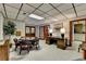 Finished basement featuring a wood-burning fireplace, office area, and neutral decor at 5335 Bannergate Dr, Johns Creek, GA 30022