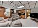 Spacious basement with built-in bookshelves, wet bar, and comfortable seating area at 5335 Bannergate Dr, Johns Creek, GA 30022