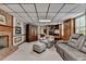 Cozy basement area with a brick fireplace and comfortable seating at 5335 Bannergate Dr, Johns Creek, GA 30022