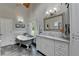 Bathroom featuring gray floors, bathtub, natural light, vanity and fixtures at 5335 Bannergate Dr, Johns Creek, GA 30022