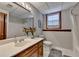 Well-lit bathroom featuring a vanity with solid surface countertop and tub with shower at 5335 Bannergate Dr, Johns Creek, GA 30022