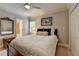 Cozy bedroom with neutral walls and a bed with a plush white comforter at 5335 Bannergate Dr, Johns Creek, GA 30022