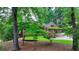 Charming single-Gathering home in a serene, wooded setting at 5335 Bannergate Dr, Johns Creek, GA 30022