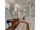 Hallway featuring decorative wainscoting, hardwood floors, and elegant trim at 5335 Bannergate Dr, Johns Creek, GA 30022