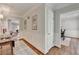 Hallway featuring decorative wainscoting, hardwood floors, and elegant trim at 5335 Bannergate Dr, Johns Creek, GA 30022