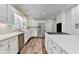 Well-lit kitchen with white cabinets, stainless steel appliances, and marble countertops at 5335 Bannergate Dr, Johns Creek, GA 30022
