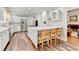 Spacious kitchen featuring white cabinets, stainless steel appliances, and a large island at 5335 Bannergate Dr, Johns Creek, GA 30022