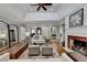 Bright living room with hardwood floors, fireplace, high ceilings, and contemporary decor at 5335 Bannergate Dr, Johns Creek, GA 30022