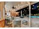 Spacious brick patio with string lights, ample seating, and pool view at 5335 Bannergate Dr, Johns Creek, GA 30022