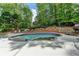 Beautiful pool with natural landscaping with stone steps leading to an upper tier at 5335 Bannergate Dr, Johns Creek, GA 30022