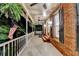Relaxing covered porch with ceiling fans, rocking chair, and swing for outdoor enjoyment at 5335 Bannergate Dr, Johns Creek, GA 30022