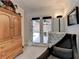 Sitting room with arm chair and access to the brick patio through french doors at 5335 Bannergate Dr, Johns Creek, GA 30022
