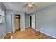 Charming bedroom with blue walls, hardwood floors, ceiling fan and closet at 6419 Danbury Ln, Norcross, GA 30093