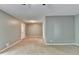 Bright, open living area with neutral paint, wall to wall carpeting and white door to the backyard at 6419 Danbury Ln, Norcross, GA 30093