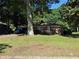 Charming brick single-Gathering home featuring attached garage and well-maintained lawn at 1215 Sheppard Pl, Stone Mountain, GA 30083