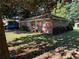 Charming, single-story brick home with mature landscaping and ample natural light at 1215 Sheppard Pl, Stone Mountain, GA 30083