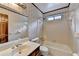 Bathroom features a shower-tub combination, toilet, sink, and decorative wallpaper at 478 Guilford Cir, Marietta, GA 30068