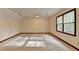 Well-lit bedroom with natural light from two windows, neutral walls, and carpet flooring at 478 Guilford Cir, Marietta, GA 30068