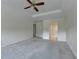 Spacious bedroom featuring a tray ceiling, ceiling fan and bright, neutral paint at 478 Guilford Cir, Marietta, GA 30068