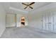 Bedroom features a tray ceiling, ceiling fan, ensuite bath and closet at 478 Guilford Cir, Marietta, GA 30068