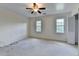 Spacious bedroom with dual windows offering natural light and a ceiling fan for comfort at 478 Guilford Cir, Marietta, GA 30068