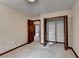 Bedroom with carpet, open closet, and view to hallway at 478 Guilford Cir, Marietta, GA 30068