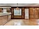 Dining room features hardwood floors and wood-paneled walls next to the kitchen area and backyard access at 478 Guilford Cir, Marietta, GA 30068