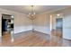 Bright dining area with hardwood floors and a classic chandelier at 478 Guilford Cir, Marietta, GA 30068
