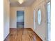 Beautiful foyer featuring hardwood floors, decorative lighting, and an elegant glass front door at 478 Guilford Cir, Marietta, GA 30068