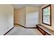 Hallway with trim detail and window seat storage in this bright, carpeted home at 478 Guilford Cir, Marietta, GA 30068