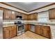 Traditional kitchen with granite countertops and stainless appliances at 478 Guilford Cir, Marietta, GA 30068