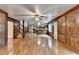Open-concept living room with hardwood floors, adjacent kitchen, and staircase leading upstairs at 478 Guilford Cir, Marietta, GA 30068