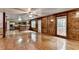 Bright living room with an open kitchen, hardwood floors, and multiple windows at 478 Guilford Cir, Marietta, GA 30068