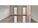 Spacious living room featuring hardwood floors and two bright windows at 478 Guilford Cir, Marietta, GA 30068