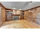 Elegant living room with hardwood floors, a fireplace, and custom built-in bookshelves at 478 Guilford Cir, Marietta, GA 30068