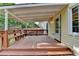 Comfortable covered patio with built-in bench, perfect for enjoying serene backyard views at 478 Guilford Cir, Marietta, GA 30068