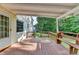 Inviting wooden patio with bench, ideal for outdoor gatherings and enjoying the backyard view at 478 Guilford Cir, Marietta, GA 30068