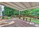 Spacious wooden patio with bench seating, perfect for outdoor entertaining and relaxation at 478 Guilford Cir, Marietta, GA 30068