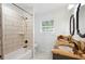 Updated bathroom with modern tile shower and vanity with double sinks at 1125 Murray Sw Cir, Marietta, GA 30064
