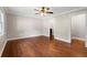 Spacious bedroom features hardwood floors, a ceiling fan, and neutral paint tones at 1125 Murray Sw Cir, Marietta, GA 30064
